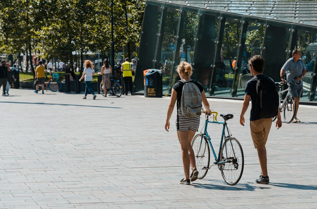man and woman walking in city