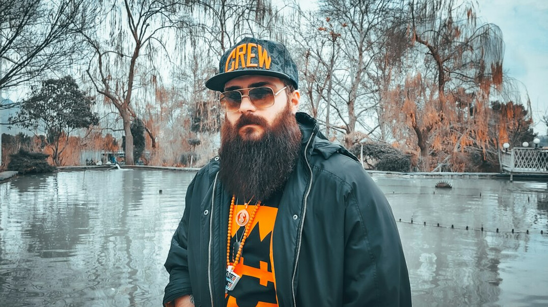 Portrait of a man photo editor with beard